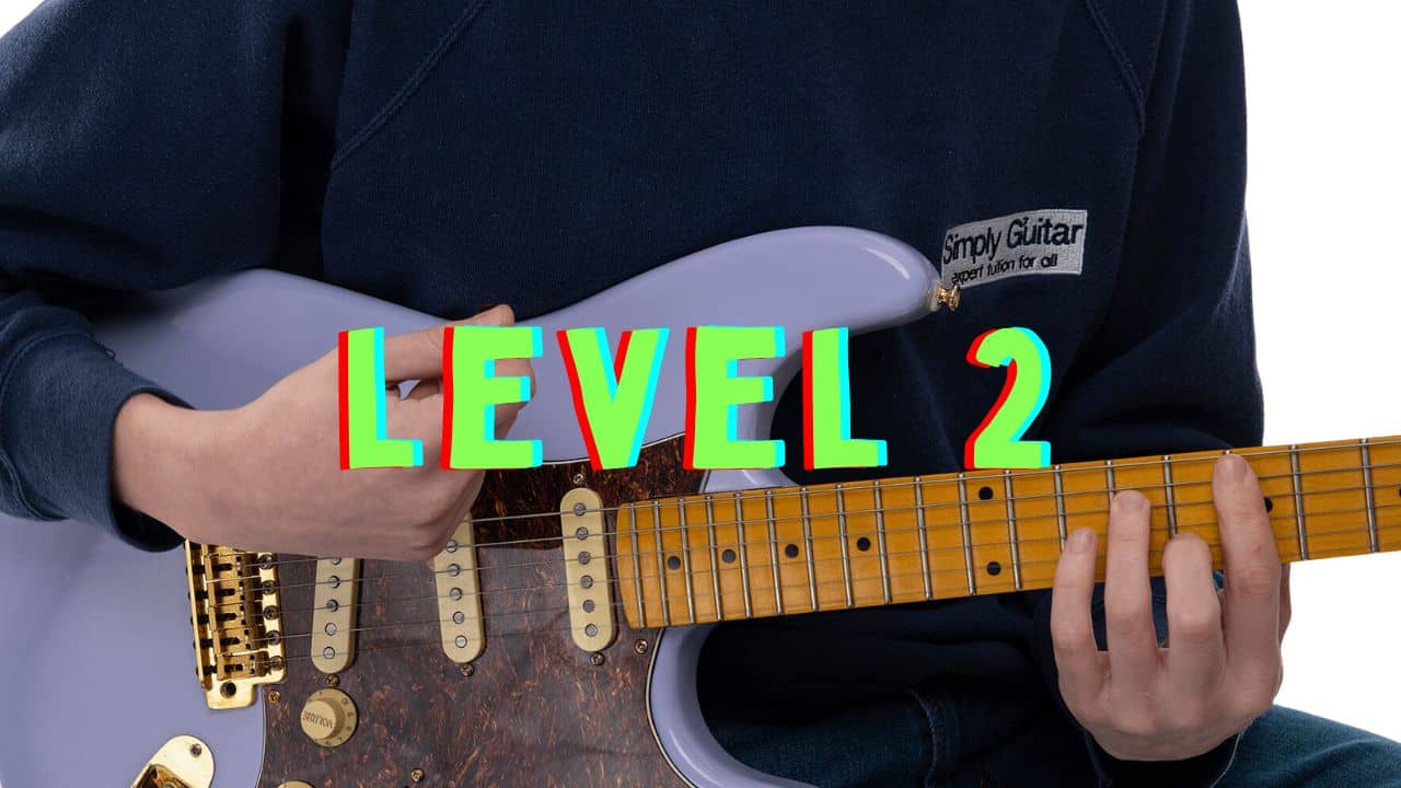 a person holding a guitar with level 2 in green text across them